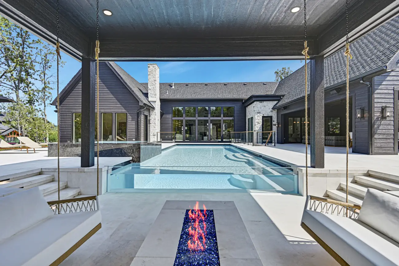 Pool with fire feature and covered terrace